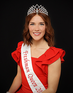 Headshot of 2025 Freshman Queen Abbey Elam wearing her tiara and sash with a red dress.
