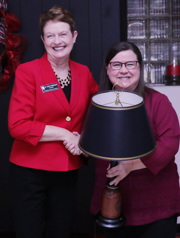 Valarie Case receiving lamp from Dr. Cunningham