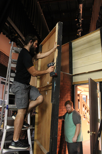 Chris Chauncey, a crew member of the play, and Mickey Jordan, the director of the upcoming theatrical production, “Arsenic and Old Lace” construct a wall for final rehearsals before the plays debut Oct. 3-4 at 7 p.m. and Oct. 1 at 3 p.m.