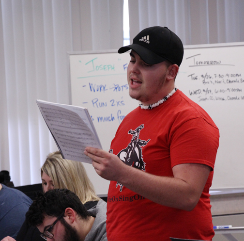 Rehearsing a scene from the upcoming musical “Joseph and the Amazing Technicolor Dreamcoat” at Northwestern is Joseph Bowden, Kiowa, Kansas, freshman, who portrays the lead character of Joseph. The show will take place in Herod Hall Auditorium on April 11-12 at 7 p.m. and April 13 at 2 p.m.