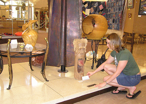 Christa Evans Rogers helping with first art show in 2004.