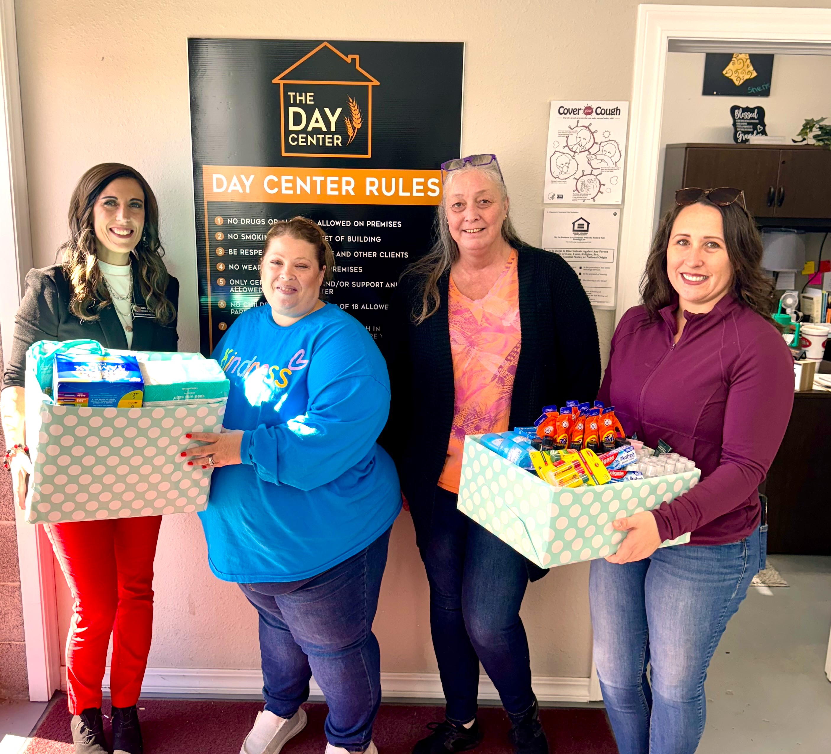 Codi Harding (left), Northwestern Department of Social Work director of social work field education, assistant professor of social work and SWAT sponsor, and Melanie Yager (right), SWAT vice president of the Woodward Chapter, donated the supplies from the SWAT ‘Compassion in Action’ Dignity Drive to Shanna Gonser and Teresa McBroom (center) of the Hope Center in Woodward. 