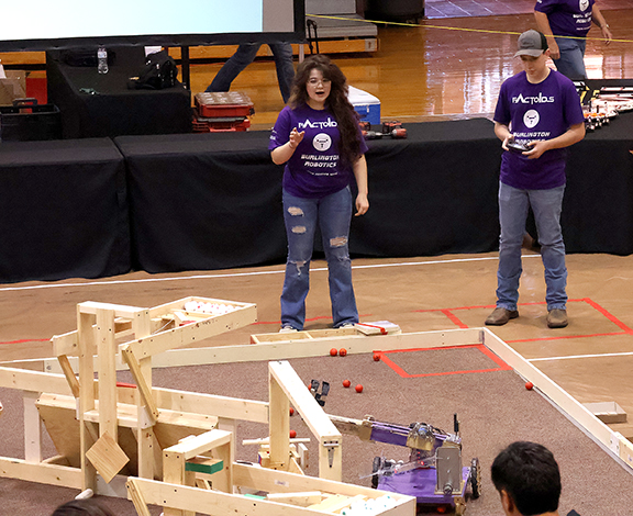 Burlington High School team competing on the game floor during the Heartland BEST Robotics Contest at Northwestern-Alva.