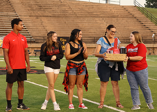 Debra, Latisha and Rayah Goodfellow, the family of Northwestern Rangers Jailon and Amari Goodfellow, were given the award for the family who traveled the furthest distance to attend the annual Family Day events during halftime of the Ranger football game. They came 1,868 miles from Arlington, Washington.