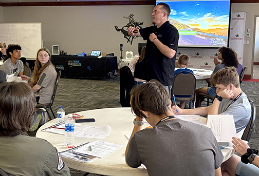 Casey Heiser talking to students