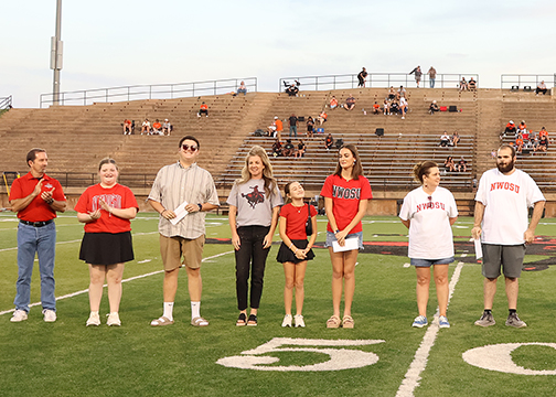 Northwestern Foundation Chief Executive Officer Skeeter Bird (far left) presented three Northwestern students and families with tuition scholarships during halftime of the Ranger football game. Receiving the $500 tuition giveaway is Aidan Slater; Madison Hayes is the winner of the $300 tuition prize; and Levi LeCrone is the $200 tuition prize winner.