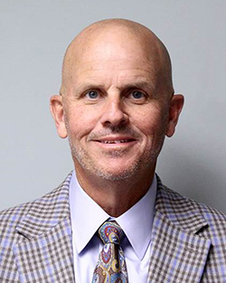 Headshot of Northwestern alumnus and NWOSU Fall 2025 Commencement Speaker, Thad Dilbeck