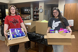 Isabella Burden, Medicine Lodge, Kansas, junior, and Alana Shotpouch, Jay senior, from the Northwestern Oklahoma State University Social Workers Association of Tomorrow (SWAT) chapter delivered donated personal hygiene products to Youth and Family Services Family Court Systems in Enid.