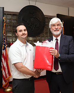 Dr. Garrett Lahr (left) was presented with this year’s John Barton Distinguished Teaching and Service Award by Dr. James Bell (right).