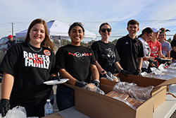 Members of the Northwestern Scholar Ambassadors (left to right) Janie Rempel, a junior elementary education major from Forgan; Edna Garcia, a junior psychology major from Beaver; Kenzie Koehn, a biology graduate from Okeene; and adviser Ethan Sacket serve food at the 2024 Family Day Tailgate Party at Ranger Field. Northwestern’s annual Family Day is Saturday, Sept. 27, 2025.