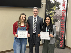 Dr. Steve Maier (center), Northwestern dean of faculty, presents the Fall 2025 Guthrie Scottish Rite scholarships to Mary Kate Foster (left), a senior health and sports science education major from Alva, and Brianda Diaz (right), a senior early childhood education major from Carson City, Nevada.