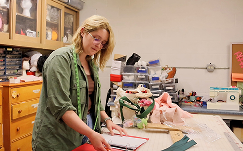 Jaden Matthews, a senior speech/theatre major from Hennessey, works in the shop to create costumes for Northwestern’s upcoming musical “Little Shop of Horrors.” Matthews is also portraying Audrey in the production.