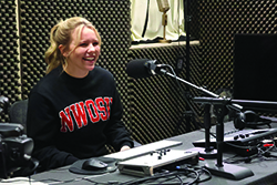 Enid senior media and communication major Jaxy Cloud of Enid records a media segment in the program’s podcast studio. 