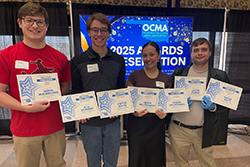 Northwestern News staff attending the Oklahoma Collegiate Media Association Conference on April 1 show off seven first-place awards. Staff attending include (from left) Oaklee Fielder, sports editor; Victor Kinzie, advertising manager and photographer; Ingrid Maldonado, photo editor; and Kevin Kaumans, entertainment editor.