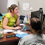 Dr. Krystal Elliott, assistant professor of nursing, is enrolling a student at last year’s event. 