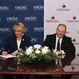 Dr. Diana Lovell and Dr. Bo Hannaford signing. 
