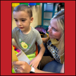 Amanda McCamey assists one of her kindergarten students at Washington Early Childhood Center.