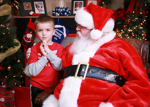 Rett Oswald, son of Assistant Professor of Education Dr. Jennifer Oswald and husband Nick, contemplates what he’d like for Santa Claus to bring him for Christmas during the 2018 Photos with Santa and Holiday Store for Kids event. Santa and the store will be back this year on Saturday, Dec. 14, from 10 a.m. to 2 p.m. in the Northwestern Student Center.