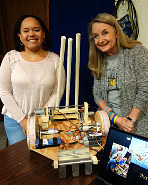 Alva High School student Elisabeth Ridgway and her mom/robotics coach April Ridgway show off the robot they plan to use at the annual Northwestern Heartland BEST robotics competition at the Alva Recreation Center on Nov. 2 at 10:30 a.m.
