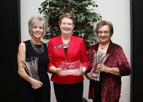 35-year service recognition: Myra Davison, administrative assistant in the president’s office; and Annette Schwerdtfeger, cashier. 40-year service recognition: Dr. Janet Cunningham, university president.