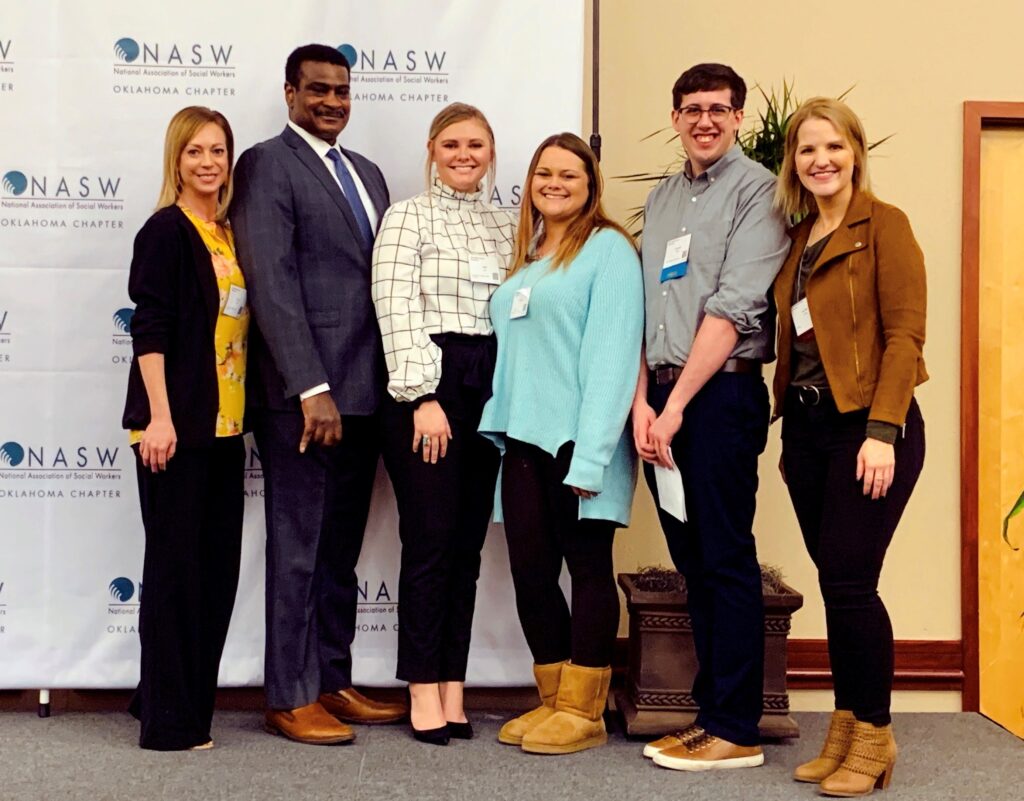 Social work faculty and students attend the 45th NASW-OK annual state conference. Pictured (left to right) Dr. Kylene Rehder, chair of the department of social work; Dr. Angelo McClain, NASW CEO; Kallie Jones, Desiree Fritz, and Jonathan Wales, social work students; and assistant professor Jennifer Pribble.