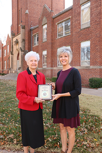 Myra Davison (right) is presented with the Thelma Crouch Staff Employee of the Year award from its namesake.