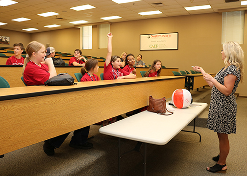 Taylor Wilson visits with the middle schoolers about taking care of their mental health.