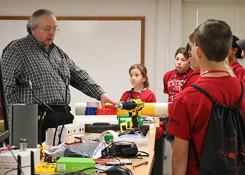Mark Bagley tells the MASH Campers how getting a degree in computer science and working with robotics can help them work within the health services area.