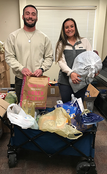 Shaughnessy Kelly and Olivia Yandel, assistant director and director of the J.R. Holder Wellness Center at Northwestern, delivered 110 pounds of donations to the Campus Cabinet Food Pantry at the close of the facility’s annual Food Drive February.