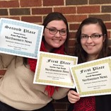 Northwestern News editors Ashley Strehl (left) and Michelle Willson show off some of the awards the newspaper’s staff won April 6 at the Oklahoma Collegiate Media Association spring conference at Oklahoma State University in Stillwater.
