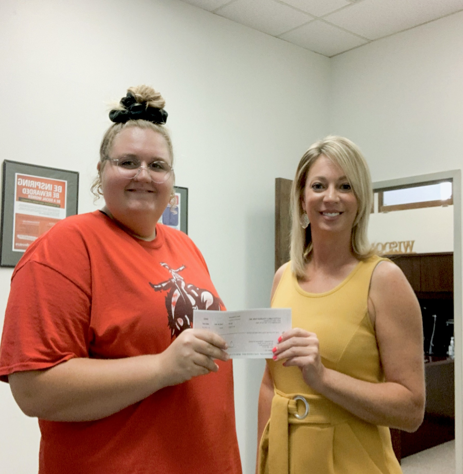 (Left) Harlie Altland, freshman social work major, and Dr. Kylene Rehder, social work department chair and professor of social work, accept the Potts Family Foundation gift.