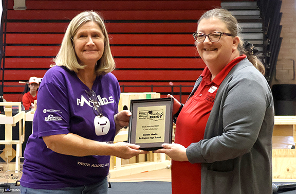 Jennifer Newlin (left), Burlington High School Robotics Team Coach, is the winner of the 2025 Coach of the Year Award given out during the awards ceremony at the Heartland BEST Robotics Competition at Northwestern Oklahoma State University-Alva. Dr. Jenny Sattler presented the plaque.