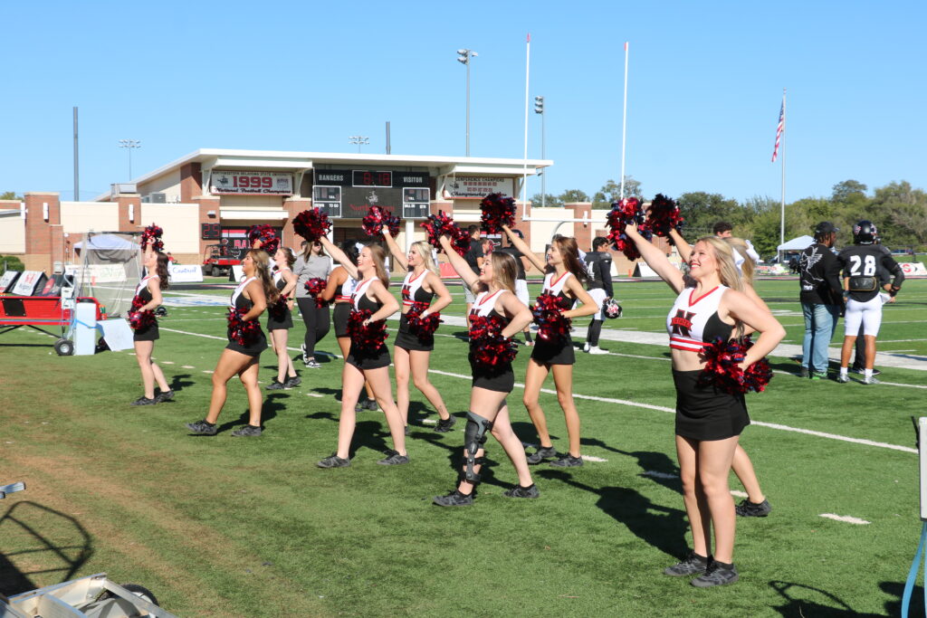 The cheerleaders keeping the crowd energized.
