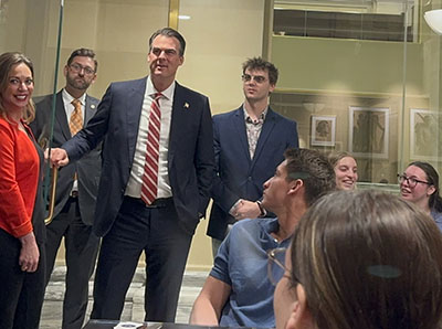 Social work students and faculty visit with Gov. Kevin Stitt during the LEAD Day event at the Oklahoma State Capitol.
