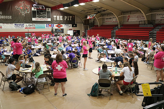 Students work diligently on a project at the Oklahoma Association of Student Councils BASIC leadership workshop as they come together in Percefull Fieldhouse on the campus of Northwestern Oklahoma State University-Alva after having smaller breakout sessions throughout the day.