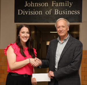 Henry Bickerstaff (right) presents a $2,000 scholarship award to Sarah Brashears, a Northwestern Oklahoma State University senior accounting major from Beaver, on behalf of the Oklahoma Society of Certified Public Accountants.