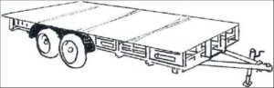 Sheets of plywood laid over the pallets to form a flat platform across the trailer bed.