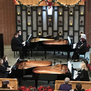 Keyboards at Christmas concert at the Presbyterian Church. Five pianos played by several different pianists.