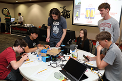 STEM camp students (left-to-right) Alexander Burch, Alex Delano, Jackson Crawford, Ellie Keller, Northwestern student Coy Bullard and Reese Powell learn about battery storage at the Renewable Energy camp at Northwestern Oklahoma State University.